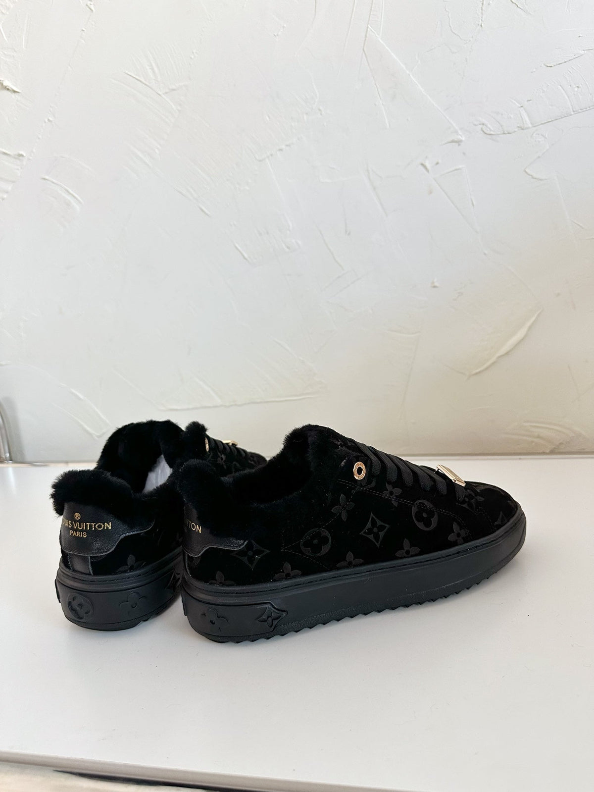 TIME OUT SNEAKER IN BLACK MONOGRAM EMBOSSED SUEDE WITH FLEECE LINING